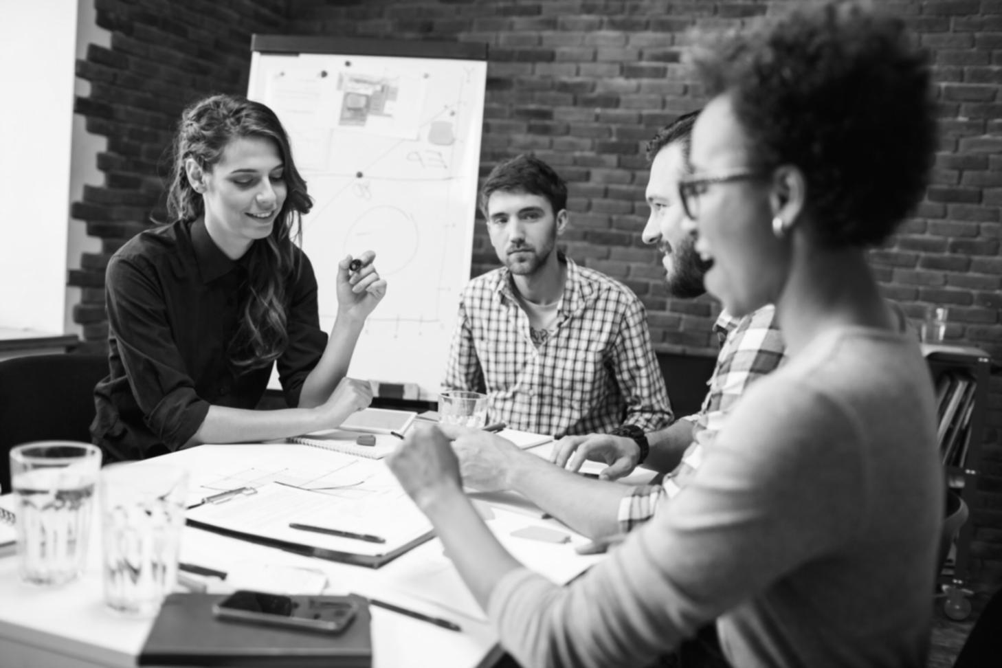 Professional budget analysis session showing financial documents and planning materials